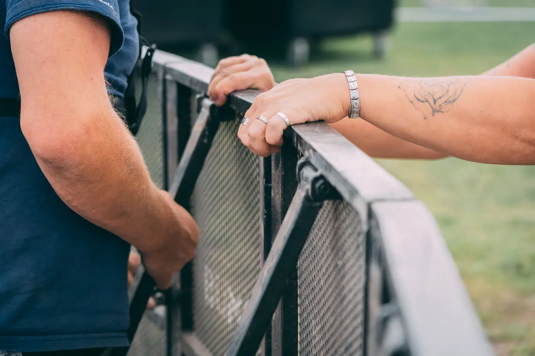 Crew installing MOJO crowd control barriers at an event
